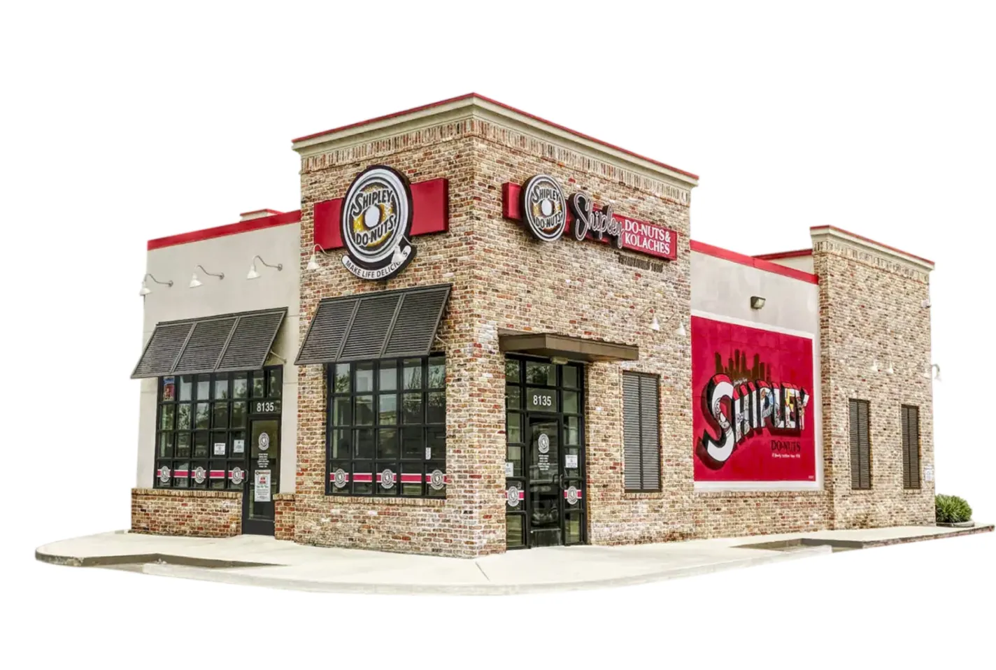 Exterior view of a Shipley Do-Nuts store with brick walls, large windows, and branded signage.